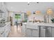Bright kitchen with stainless steel appliances, open to dining area, and a large farm style sink at 517 S 165Th Dr, Goodyear, AZ 85338