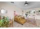 Cozy living area with a comfortable sofa, decorative rug, and modern wall decor at 517 S 165Th Dr, Goodyear, AZ 85338
