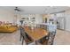 Open floor plan featuring a dining area, kitchen with island, and comfortable living space at 517 S 165Th Dr, Goodyear, AZ 85338