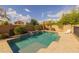 Backyard pool surrounded by landscaping, perfect for relaxation and outdoor entertaining in a private setting at 517 S 165Th Dr, Goodyear, AZ 85338