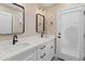This bathroom includes double sinks, elegant framed mirrors, and a door to the outdoors at 6220 E Paradise Ln, Scottsdale, AZ 85254