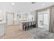 Bright kitchen with stainless steel appliances, a kitchen island with barstool seating, and a sliding door to the backyard at 6220 E Paradise Ln, Scottsdale, AZ 85254