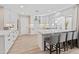 Modern kitchen with white cabinets, stainless steel appliances, and a center island for food preparation and seating at 6220 E Paradise Ln, Scottsdale, AZ 85254