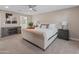 Spacious main bedroom features soft carpet, ceiling fan, and access to an ensuite bathroom at 6220 E Paradise Ln, Scottsdale, AZ 85254