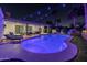 Inviting backyard with a sparkling pool, lounge chairs, and stylish patio furniture, perfect for relaxation under string lights at 6220 E Paradise Ln, Scottsdale, AZ 85254