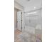 Walk in shower with glass doors, rain head, hand held and bench seating at 6220 E Paradise Ln, Scottsdale, AZ 85254
