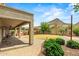 Landscaped backyard featuring desert mountain views, covered patio, and low-maintenance turf at 6245 W Maya Dr, Phoenix, AZ 85083