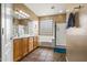 Bathroom featuring a double sink vanity, soaking tub, and a glass enclosed shower at 6245 W Maya Dr, Phoenix, AZ 85083