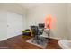 Bedroom with hardwood floors and a white closet door at 6245 W Maya Dr, Phoenix, AZ 85083