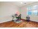 Bedroom with hardwood floors and a window with mountain views at 6245 W Maya Dr, Phoenix, AZ 85083