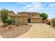 Charming two-story home featuring a well-manicured yard and a spacious driveway leading to a two-car garage at 6245 W Maya Dr, Phoenix, AZ 85083