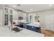 Kitchen featuring modern appliances, white and blue cabinets, and a quartz countertop island at 6245 W Maya Dr, Phoenix, AZ 85083