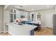 Gourmet kitchen boasts white countertops, blue cabinets, and stainless steel appliances at 6245 W Maya Dr, Phoenix, AZ 85083