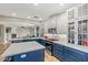 Kitchen featuring a central island with a quartz countertop, white cabinets, and stainless steel appliances at 6245 W Maya Dr, Phoenix, AZ 85083