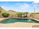 Serene backyard pool surrounded by lush landscaping, offering a private and relaxing retreat at 6245 W Maya Dr, Phoenix, AZ 85083
