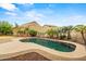 Lush backyard features a sparkling pool with ample patio space, ideal for entertaining and enjoying the desert landscape at 6245 W Maya Dr, Phoenix, AZ 85083