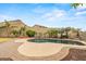 Inviting backyard pool surrounded by lush landscaping and a private fence, perfect for outdoor relaxation at 6245 W Maya Dr, Phoenix, AZ 85083