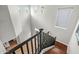 Open staircase features black railings, wood stairs, and abundant natural light from high windows at 6245 W Maya Dr, Phoenix, AZ 85083