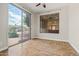 Sunroom with sliding glass doors, tile flooring, and views of the backyard pool at 6245 W Maya Dr, Phoenix, AZ 85083