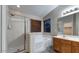 Bathroom with a separate shower and soaking tub, featuring a vanity with a sink at 6920 S 46Th Dr, Laveen, AZ 85339