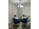 Dining area featuring a glass table, comfortable seating, and stylish decor at 6920 S 46Th Dr, Laveen, AZ 85339