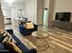 Living room with comfortable seating, a modern coffee table, and luxury flooring at 6920 S 46Th Dr, Laveen, AZ 85339
