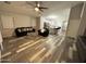 Living room with stylish furniture, a ceiling fan, and lots of natural light at 6920 S 46Th Dr, Laveen, AZ 85339