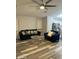Living room with stylish furniture, a ceiling fan, and an open layout at 6920 S 46Th Dr, Laveen, AZ 85339