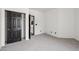 Bedroom with carpet, access to an ensuite bathroom, and a closet with sliding doors at 7601 E Roosevelt St # 1007, Scottsdale, AZ 85257