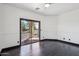 Bedroom with dark floors and sliding glass doors to a patio at 7601 E Roosevelt St # 1007, Scottsdale, AZ 85257