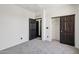 Bedroom featuring carpeting and closet space at 7601 E Roosevelt St # 1007, Scottsdale, AZ 85257