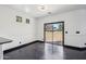 A dining room area with hardwood floors and a sliding glass door leading outside at 7601 E Roosevelt St # 1007, Scottsdale, AZ 85257