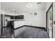 A kitchen/dining room area featuring stainless steel appliances and a sliding glass door at 7601 E Roosevelt St # 1007, Scottsdale, AZ 85257