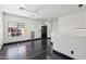 Bright room featuring hardwood floors, modern ceiling fan, and a large window for natural light at 7601 E Roosevelt St # 1007, Scottsdale, AZ 85257