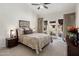 Comfortable bedroom with a patterned quilt, neutral carpet, and a large window with exterior views at 8083 E Via Del Valle --, Scottsdale, AZ 85258