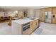 Modern kitchen with stainless steel appliances, a quartz countertop island, and open layout to living spaces at 8083 E Via Del Valle --, Scottsdale, AZ 85258