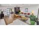 Open living room with a stone fireplace, wood floors, and comfortable seating for entertaining at 8083 E Via Del Valle --, Scottsdale, AZ 85258