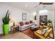 Bright living room featuring a stylish sofa, modern decor, and seamless flow into the dining and kitchen areas at 8083 E Via Del Valle --, Scottsdale, AZ 85258