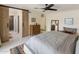 Bright main bedroom features light colors, a large mirror and a sliding barn door to the bathroom at 8083 E Via Del Valle --, Scottsdale, AZ 85258