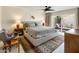 Bright main bedroom suite with a king bed, cozy sitting area, and private outdoor patio at 8083 E Via Del Valle --, Scottsdale, AZ 85258