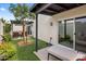 Inviting patio area with artificial grass, comfortable seating, and easy access to the sliding door at 8083 E Via Del Valle --, Scottsdale, AZ 85258