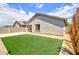 Backyard featuring artificial grass, concrete, and gravel at 809 W Kingman Dr, Casa Grande, AZ 85122