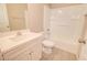 Bright bathroom featuring a shower-tub combo, tile flooring, and a modern sink vanity at 809 W Kingman Dr, Casa Grande, AZ 85122