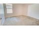 Cozy bedroom featuring carpet flooring, a closet, and a window for natural light and ventilation at 809 W Kingman Dr, Casa Grande, AZ 85122