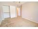 Bedroom features carpeted floors, neutral paint, a closet, a ceiling fan, and natural lighting at 809 W Kingman Dr, Casa Grande, AZ 85122
