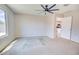 Bedroom featuring a ceiling fan and window for natural light, creating a welcoming atmosphere at 809 W Kingman Dr, Casa Grande, AZ 85122