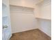 This walk-in closet features ample shelving and rod space for organized storage solutions at 809 W Kingman Dr, Casa Grande, AZ 85122
