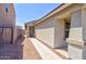 View of the front entrance of a house with a screen door and a small window to the side at 809 W Kingman Dr, Casa Grande, AZ 85122