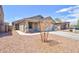 Charming single-story home with desert landscaping and a two-car garage at 809 W Kingman Dr, Casa Grande, AZ 85122