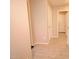 Hallway with tile flooring and neutral walls, providing a clean and modern aesthetic at 809 W Kingman Dr, Casa Grande, AZ 85122